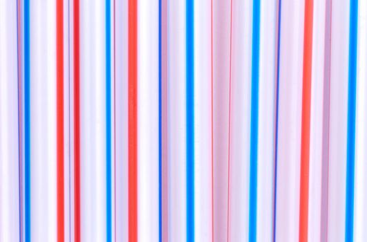 Multicolor cocktail tubes texture. On white background. Close up.