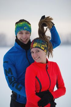 Portrait of a laughing young sportsman in winter, sport and leisure concept