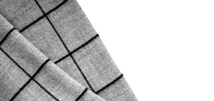 Top view of the texture of gray fabric in a large cell on a white background with an area for text