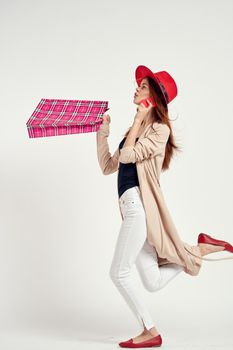 cheerful woman wearing a red hat posing shopping fun isolated background. High quality photo