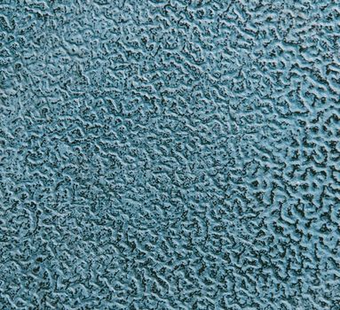 Painted metallic texture or background of blue color with rough surface.