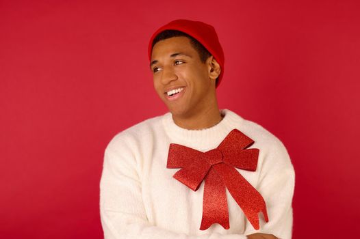 Man on red backgraound. Dark-skinned man with a red ribbon on red background