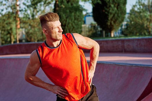 sports man on the playground in the park workout. High quality photo