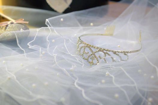 white veil lace, shining silver diadem and pink bridal shoes. bridal accessories set for happy marriage