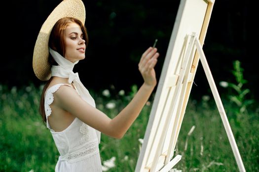 Woman in white dress artist hobby nature landscape. High quality photo