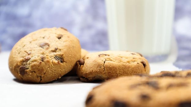American gluten free chocolate chip cookies with glass glass of vegetable milk on gray background. Chocolate chip cookies. Sweet pastries, dessert. Culinary background