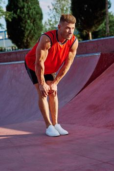 sports man on the playground in the park workout. High quality photo