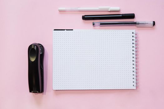School supplies. Black and white colors. Flat lay composition. Pink background. Space for text. Back to school.