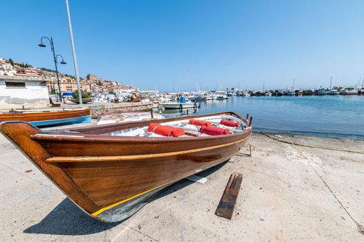 wooden boat on the lolo of porto santo stefano in the summer