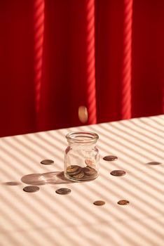 Coins in glass jar. Money savings concept