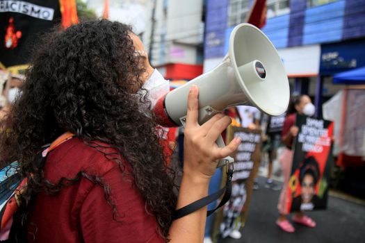 salvador, bahia, brazil - july 24, 2018: Protester uses Brazil megaphone during protest against President Jair Bolsonaro's government in Salvador city.