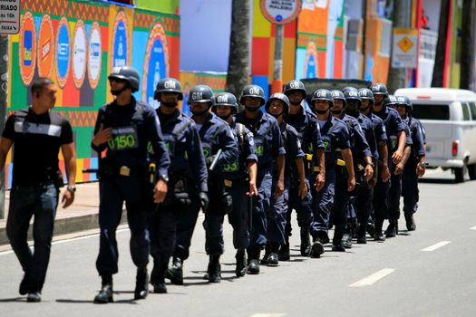 salvador, bahia, brazil - february 3, 2014: Members of the Municipal Guard are seen queuing up during patrol on the carnalval circuit in the city of Salvador.