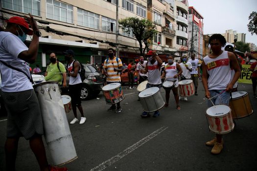 salvador, bahia, brazil - july 24, 2018:protester use drums from a percussion during protest against the government of president Jair Bolsonaro in the city of Salvador.