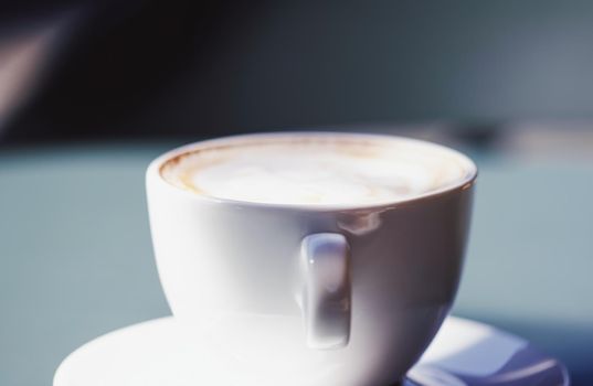 Cappuccino in summer cafe outdoors.