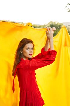 pretty woman nature yellow cloth fresh air glamor. High quality photo