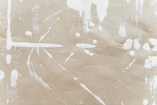 parchment messy stained by white paint with pattern of lines and splashing