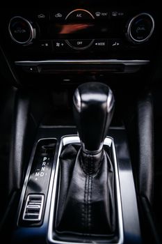 The gear shift lever in the modern car, close up shot of gearshift