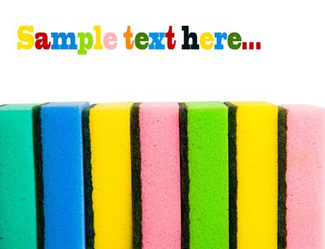 Brightly colorfull sponges on white background