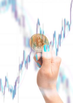 Multiexposure of female hand holding bitcoin and infographic. Cryptocurrency or virtual money.