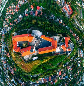 Aerial view of medieval castle on mountain in small european city in autumn season. Panorama of Palanok castle, Mukachevo, Ukraine