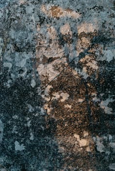 Surface of stone with ancient moss, natural texture or background.