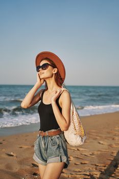 woman walking on the beach landscape sun fun lifestyle. High quality photo