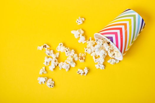 popcorn in bright holiday paper cup on yellow background
