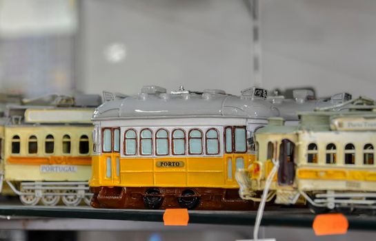 The yellow Porto and Lisbon tram. Souvenir shop.