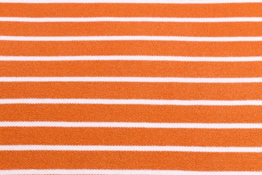 Beautiful summer background made of striped fabric of delicate colors orange