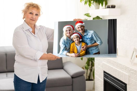 woman holding a photography with gallery stretch on a wooden frame. Printed photo on canvas.