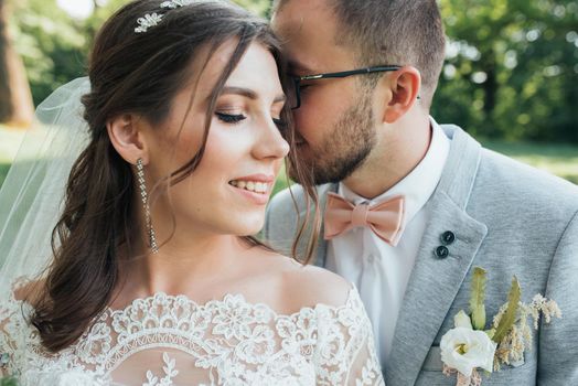 Wedding photography kiss bride and groom in different locations.