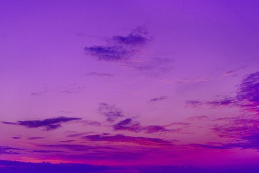 Beautiful cloudy sky background. Bright magenta, purple and pink colors sunset.