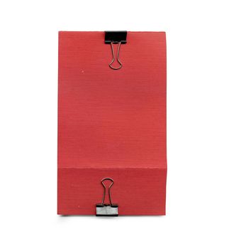 Blank of a red paper with paper clip isolated in white background
