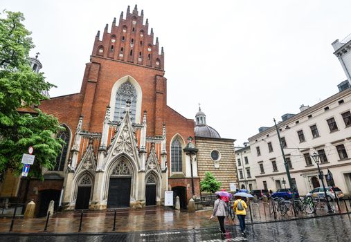 Krakow, Poland - May 20, 2019: View on Old Basilica of Holy Trinity, Krakow Poland