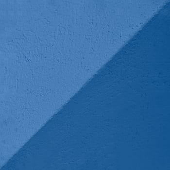 Blue and navy blue Textured Cement or concrete wall background. Deep focus. Mock up or template.