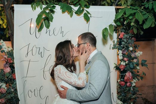 Wedding photography kiss bride and groom in different locations.