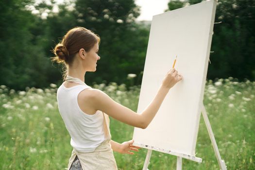 woman artist creative drawing landscape nature hobby. High quality photo