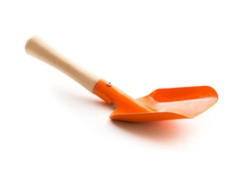 Small orange shovel isolated on white