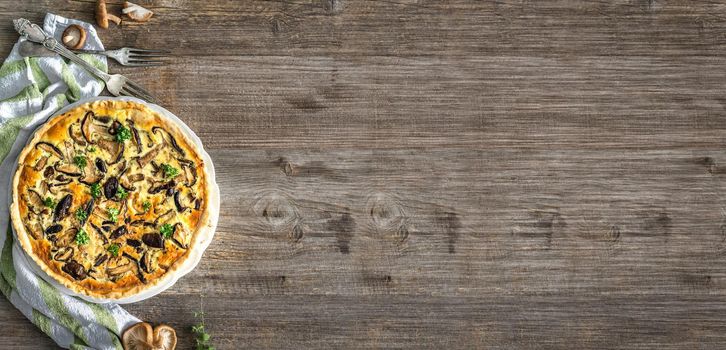 Homemade pie with mushrooms on a wooden table. top view with space for text