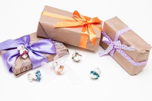 present on a white background with lilac ribbon bow brown paper