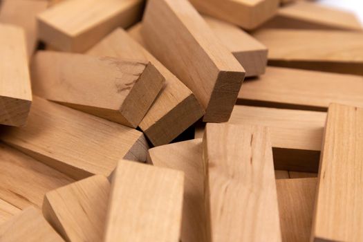 The texture of a pile of wooden blocks that lie randomly. Background