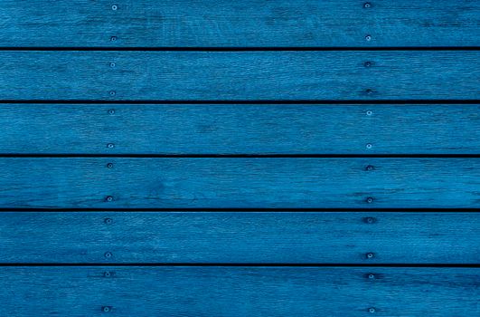 Old blue Wooden texture for background or mock up close up. Barn wall texture or rustic fence Top view on flat wood banner billboard or signboard. Trendy Banner with color of the year 2020
