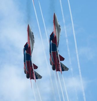 Kazan, Russian Federation - Oktober 27, 2018: Aerobatics performed by two planes of aviation group of Military-air forces of Russia Strizhi . Telephoto shot