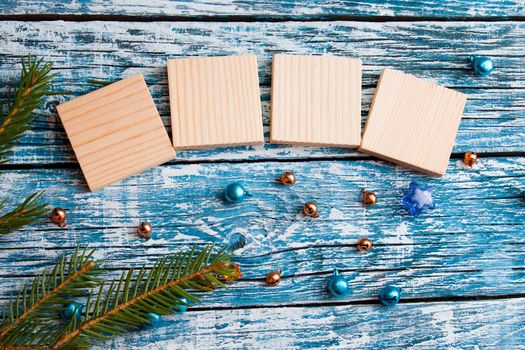 wooden cubes for your new year dates top view new year concept blue wooden background fir branch