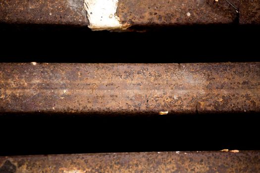 Close up of Metal grille of sewer, Pattern of square grate, Manhole drain cover in concrete road.