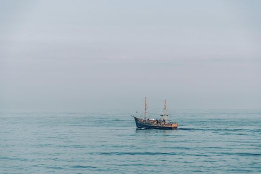 Fishing boat in the sea at serene weather