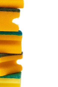 Stack of kitchen sponges isolated on white background, close up