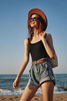 woman walking on the beach landscape sun fun lifestyle. High quality photo