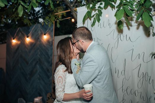 Wedding photography kiss bride and groom in different locations.