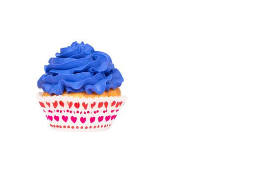 Cupcake with blue buttercream frosting isolated on white background. Copy space. Festive banner.
